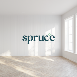 Empty apartment with light streaming through a bright window with a dark teal Spruce logo overlayed.