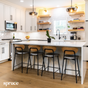 An image of a cleaned modern apartment kitchen with the Spruce logo in the bottom left corner.